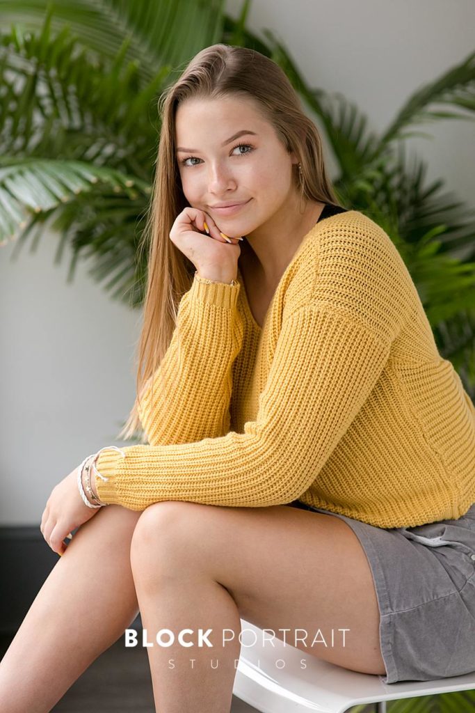 Senior picture with bright yellow shirt