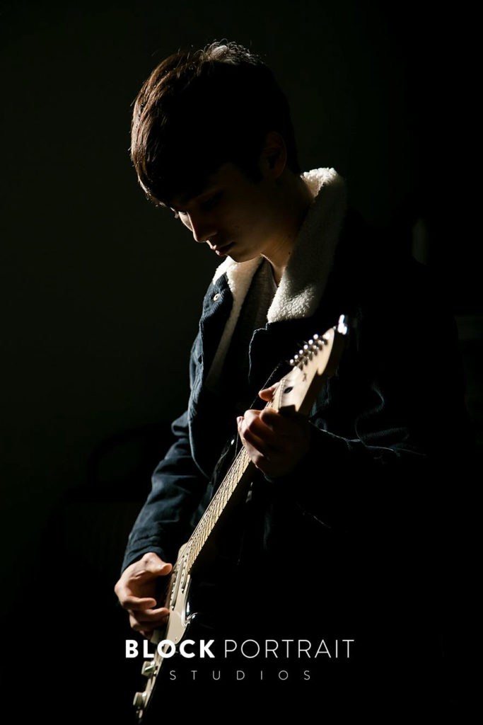Senior picture with guitar and creative lighting