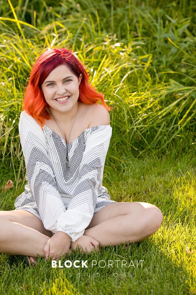 Senior picture with bright red hair
