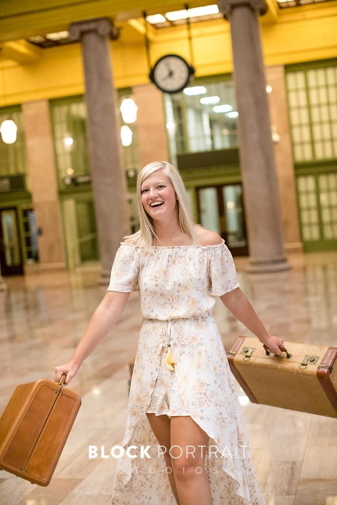 Senior Picture in Train Station with suitcase