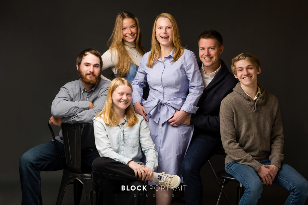 Family picture with black bacground in Saint Paul studio by Block Portrait Studios