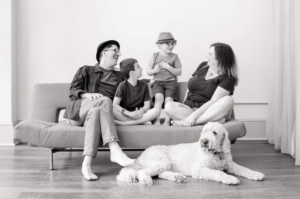 Black and white Family picture with the dog photographed by family portrait studio Block Portrait Studios in Saint Paul.