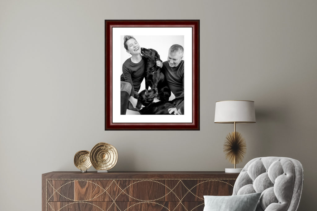 Family picture hung on the wall shot by Block Portrait Studios