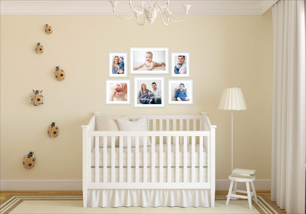 Photos of baby displayed over crib in Minnesota nursery by Block Portrait Studios