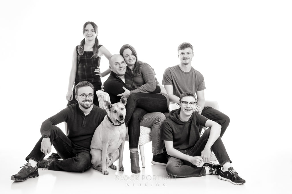 Black and white family portrait with a dog, with a family that participated in Block Portrait Studio's Photo Shoot Survival Kit.