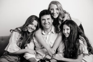 picture of dad with his girls in St. Paul photography studio by Block Portrait Studios