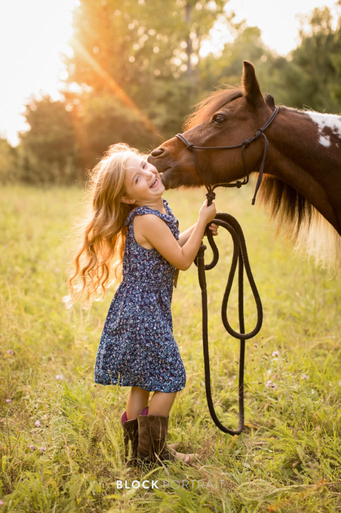 Picture of little girl and her horse in Minnesota by Block Portrait Studios