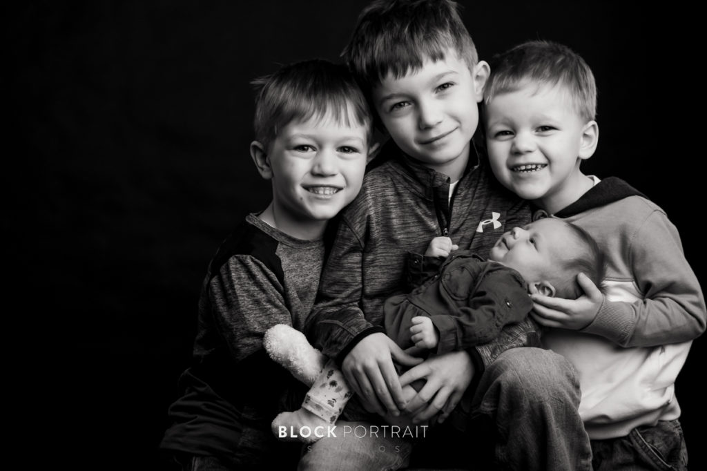 Black and White picture of baby boy and this brothers by newborn photographer Block Portrait Studios in Saint Paul Minnesota studio