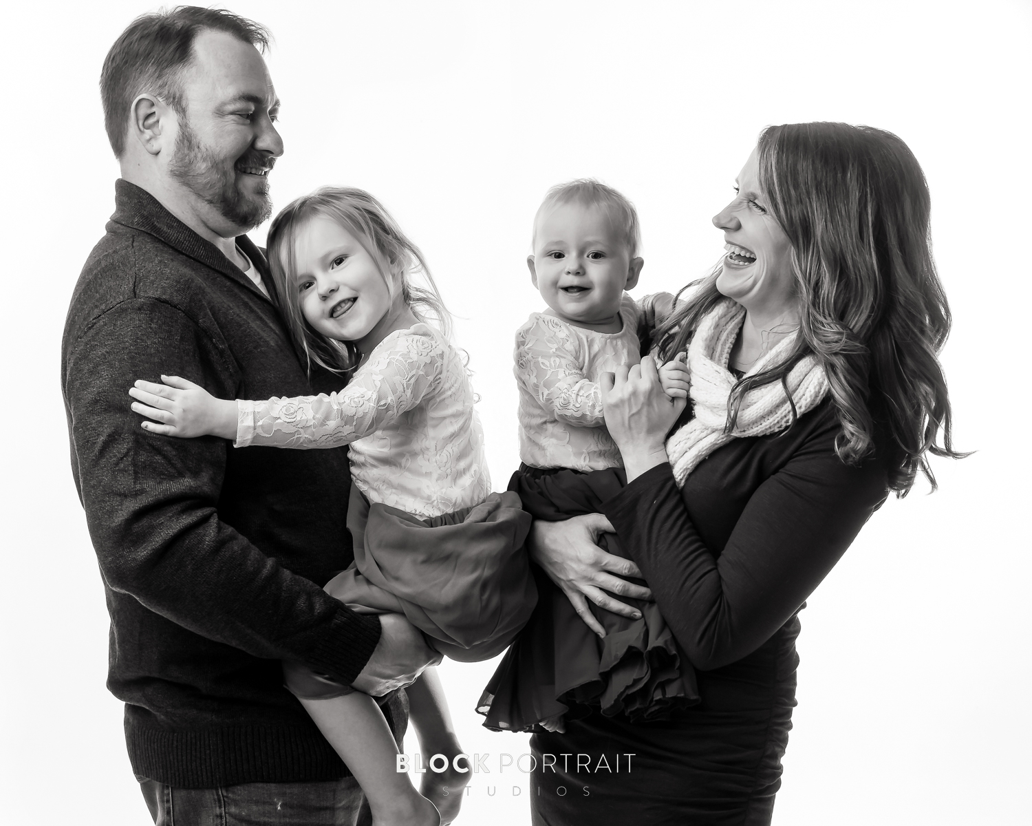 Black and White picture of family by newborn photographer Block Portrait Studios in Saint Paul Minnesota studio