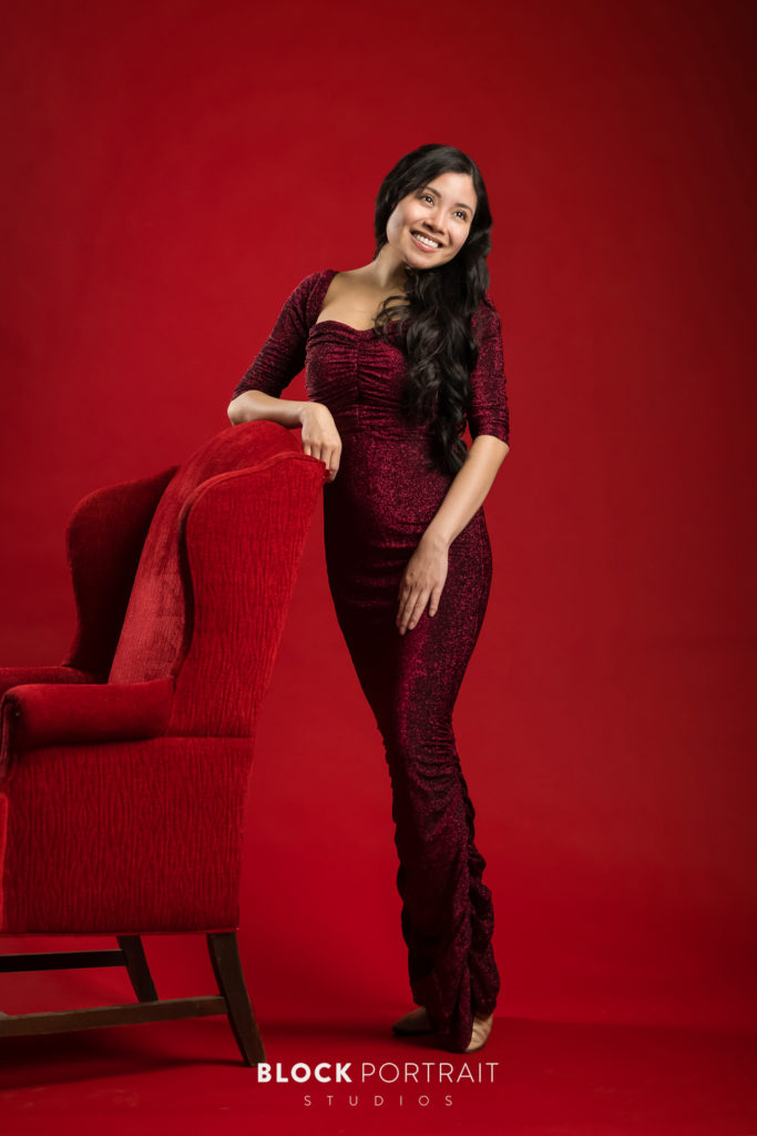 Standing portrait latina woman in red dress, by MPLS portrait photographer